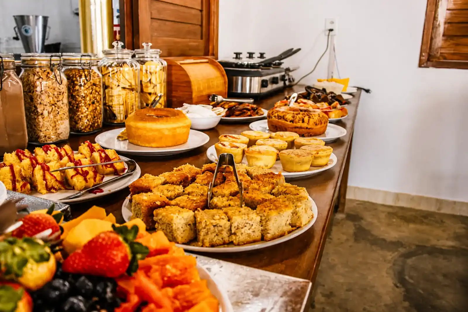 Breakfast buffet with cakes, pastries, cereals and fresh tropical fruit